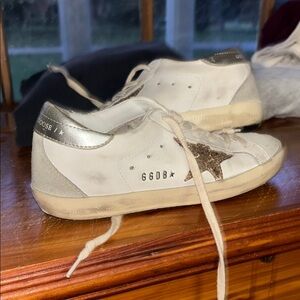 Golden Goose’s White and Gold Sneakers